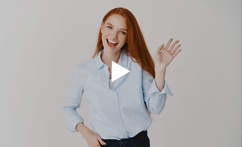 Thumbnail of an instructional video featuring a smiling red-haired student, offering helpful guidance for international students in the USA.
